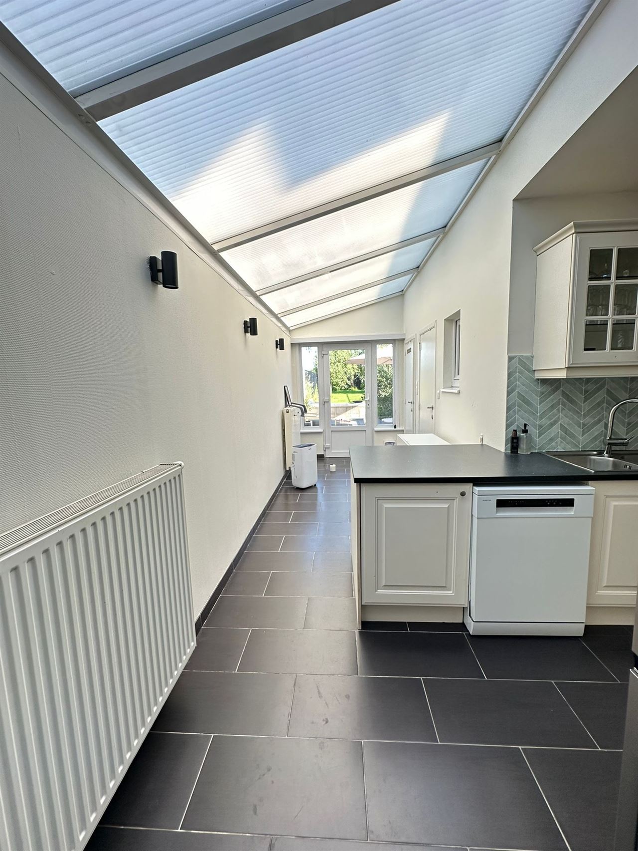 Charmante woning met 2 slaapkamers en tuin met zicht op groen.
