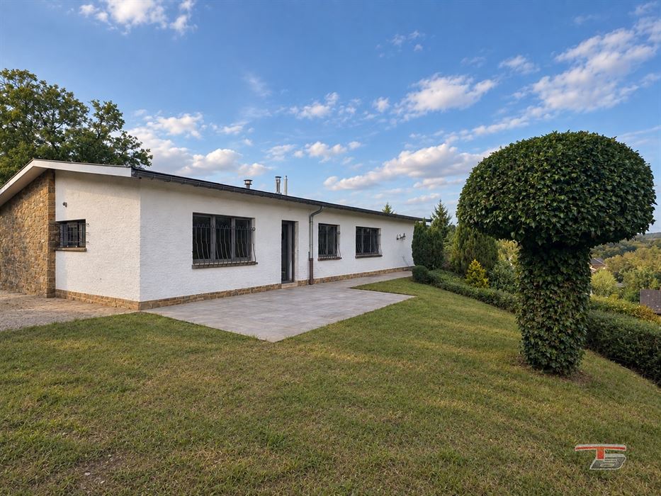Maison unifamiliale de 105 m² avec garage et jardin