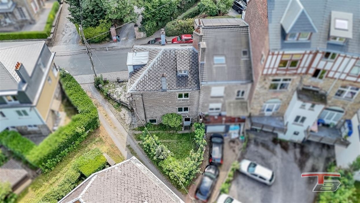 Immeuble de rapport de 2 appartements avec garage et jardinet