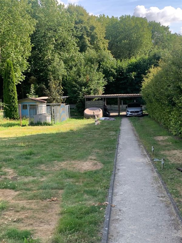 Gelijkvloers appartement met carport en terras