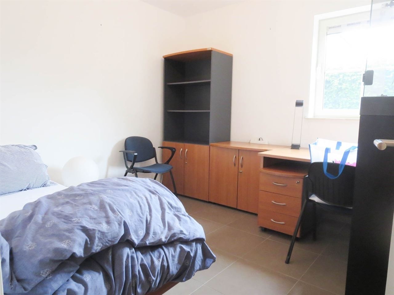 Aan de stadsrand gelegen gelijkvloers appartement