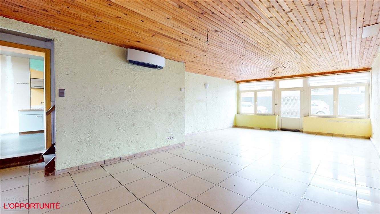 Spacieuse maison 4 chambres, jardin, garage et 100m² en gros oeuvre fermé à developper pour projet immobilier.