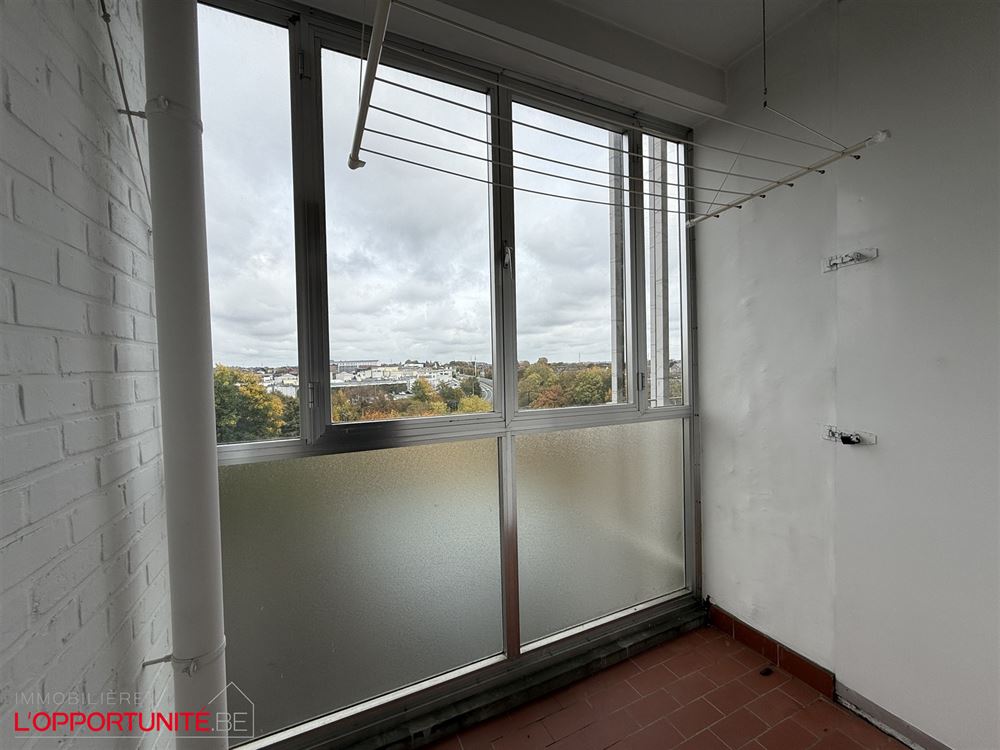 Magnifique appartement PEB B à renover, 4 chambres, garage et caves.