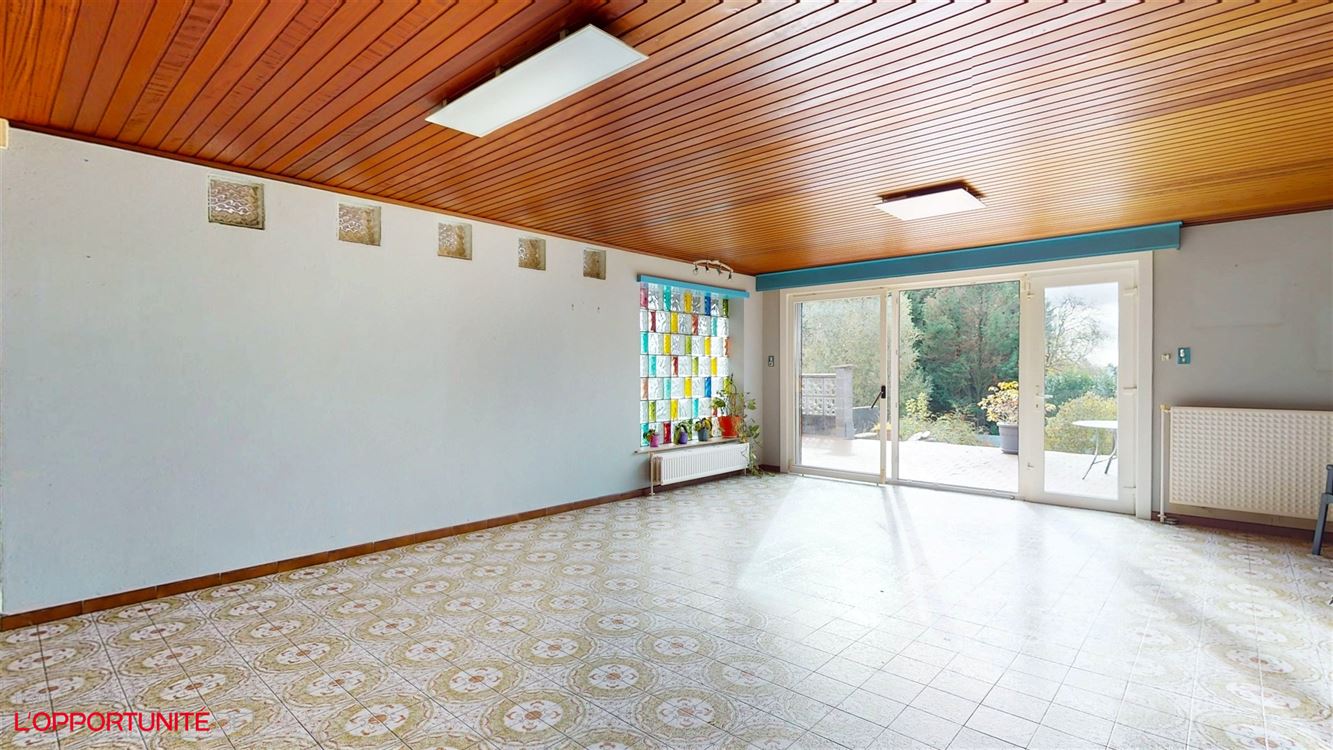 Belle maison 4 facades en bel étage inversé, deux chambres, magnifique jardin.