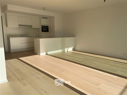 TE HUUR OP JAARBASIS - ongemeubeld nieuwbouw appartement met 2 slaapkamers - ruim terras - living met open keuken - overal vloerverwarming op gas - 2 ...