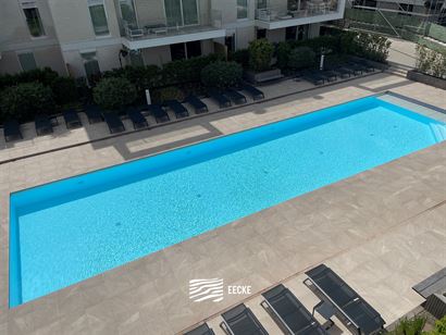 TE HUUR OP JAARBASIS - Ongemeubeld appartement in nieuwe residentie - groot zonneterras met zicht op het zwembad - woonkamer met open keuken - 2 slaap...