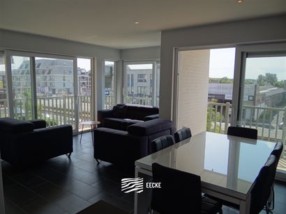 A LOUER A L'ANNEE - appartement en coin meublé avec 2 chambres et lieu de récréation - salon avec terrasse ensoleillée - cuisine équipée avec cu...