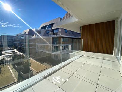TE HUUR OP JAARBASIS - Ongemeubeld appartement in nieuwe residentie - ruim terras met zicht op het zwembad - appartement is volledig geschilderd en in...