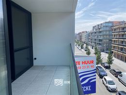 TE HUUR OP JAARBASIS - Ongemeubeld appartement in nieuwe residentie - middelgroot terras - woonkamer met open keuken - 2 slaapkamers met ingebouwde ka...