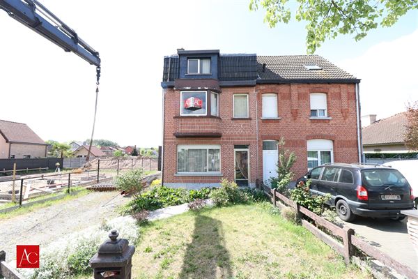Te renoveren woning met garage, tuin, 3 slpks en gunstige ligging te Bornem!