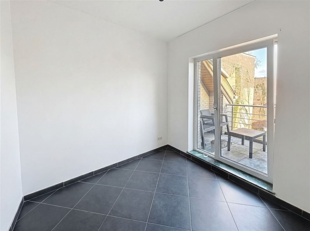 Instapklaar 2-slaapkamerappartement met terras vlakbij de Grote Markt.