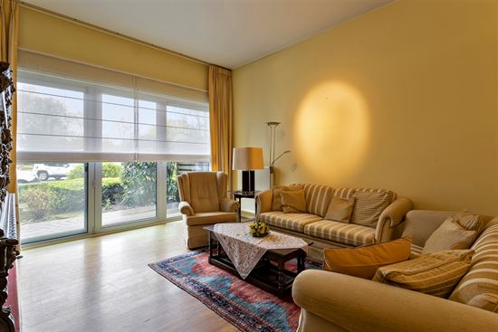 Gelijkvloers appartement + terras met hoteldiensten