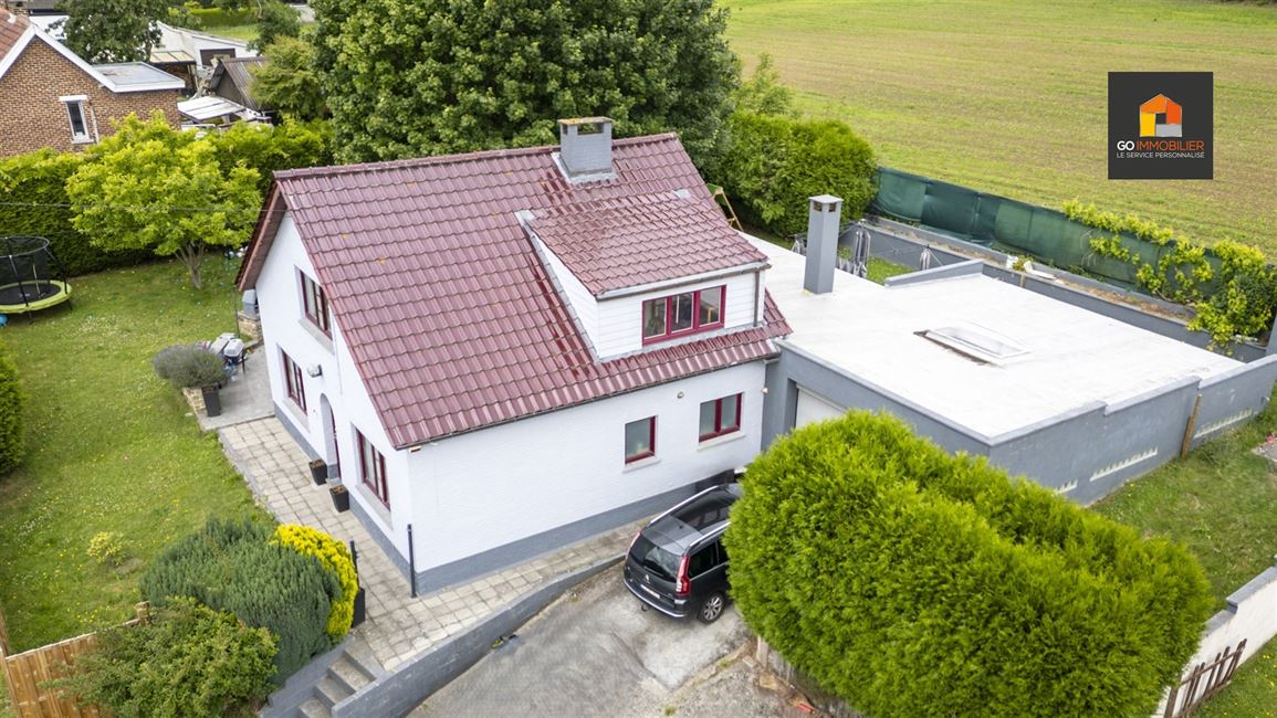 Villa 4 façades sur 13 ares – 3 chambres + entrepôt de ±71 m²