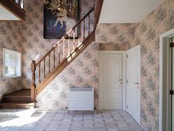 Wonen op een eiland van groen, tussen de Leie en de meersen, en toch vlak bij Gent. Deze karaktervolle woning ligt in een doodlopend straatje in de As...