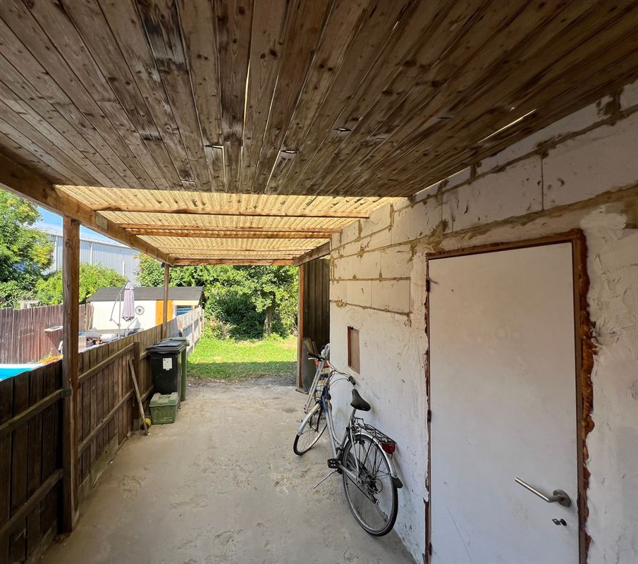 Rijwoning met tuintje en 4 slaapkamers