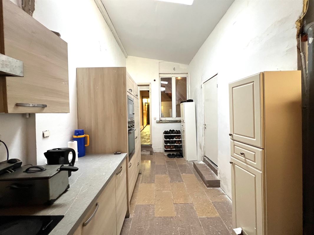 Rijwoning met tuintje en 4 slaapkamers