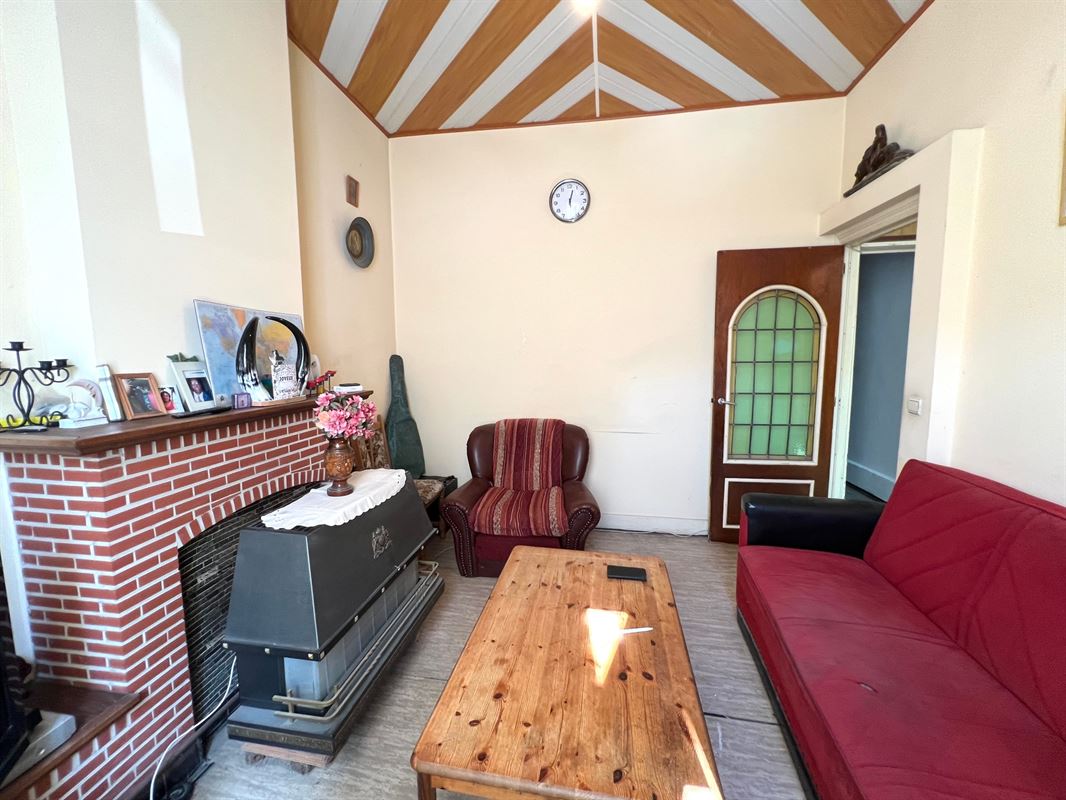 Rijwoning met tuintje en 4 slaapkamers