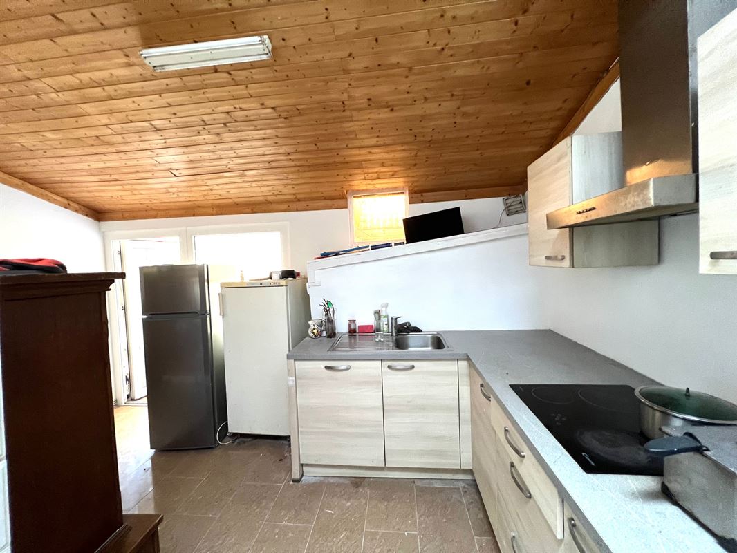 Rijwoning met tuintje en 4 slaapkamers