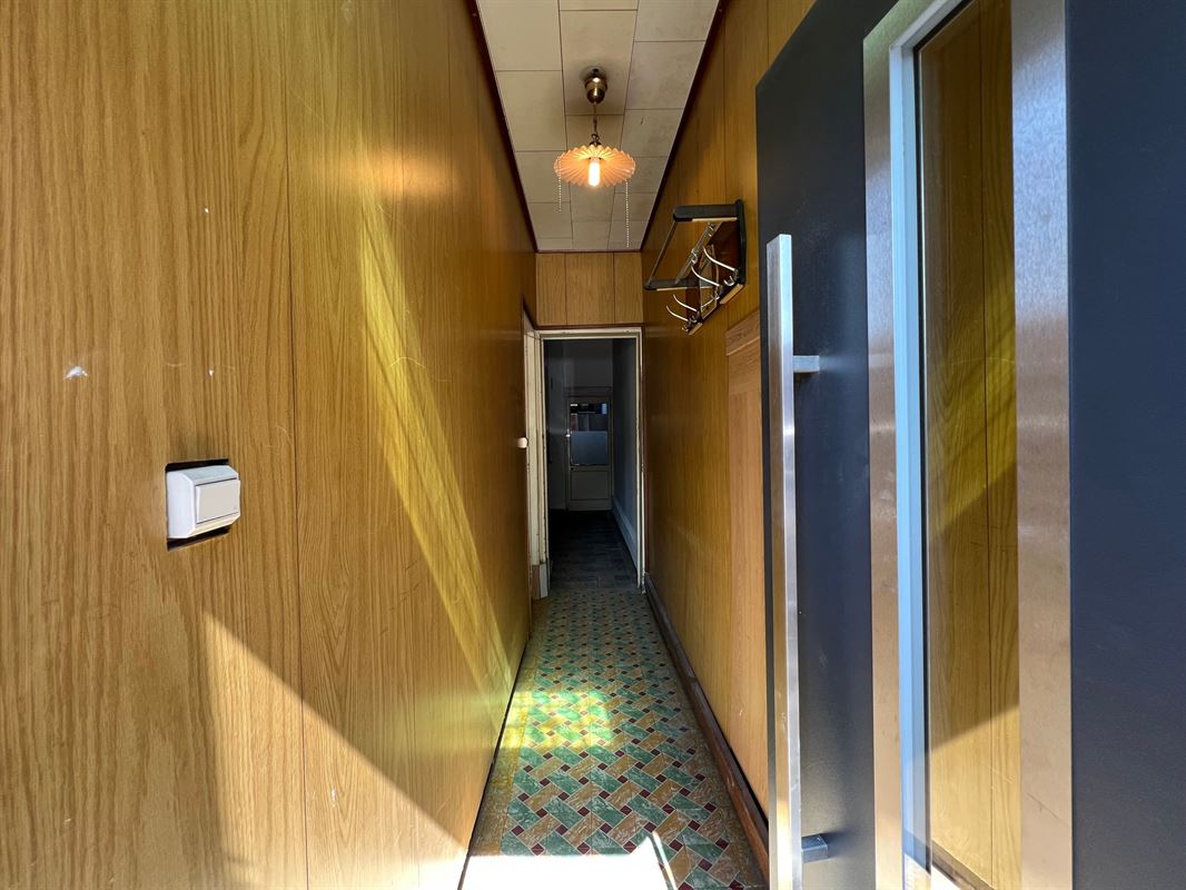 Rijwoning met tuintje en 4 slaapkamers