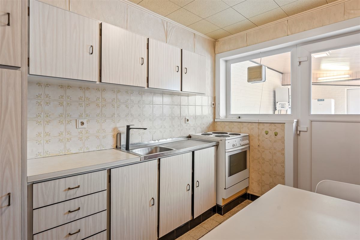 PERFECT ONDERHOUDEN WONING MET ACHTERINRIT NAAR TUIN IN BERINGEN CENTRUM
