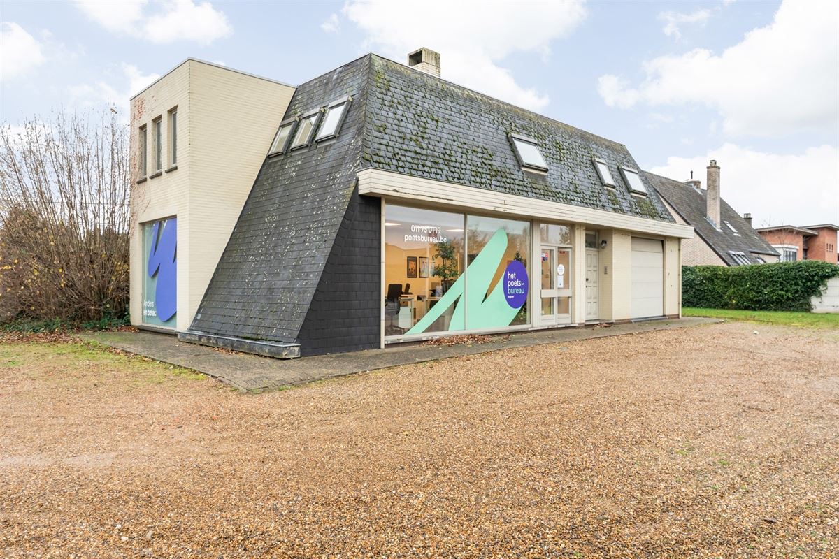 HANDELSPAND MET GOEDE VISIBILITEIT EN RUIME PARKING MET BOVENLIGGEND APPARTEMENT IN HEUSDEN-ZOLDER