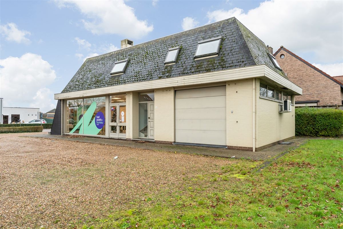 HANDELSPAND MET GOEDE VISIBILITEIT EN RUIME PARKING MET BOVENLIGGEND APPARTEMENT IN HEUSDEN-ZOLDER
