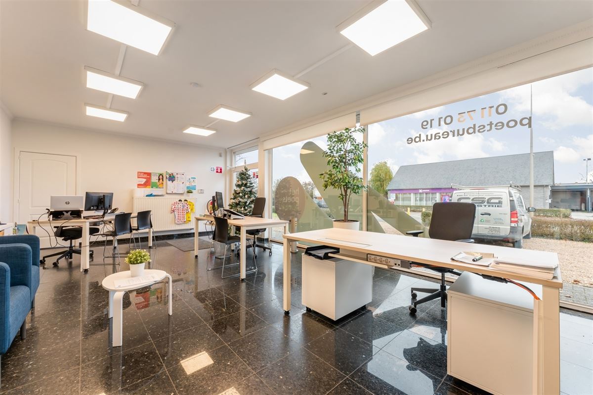 HANDELSPAND MET GOEDE VISIBILITEIT EN RUIME PARKING MET BOVENLIGGEND APPARTEMENT IN HEUSDEN-ZOLDER
