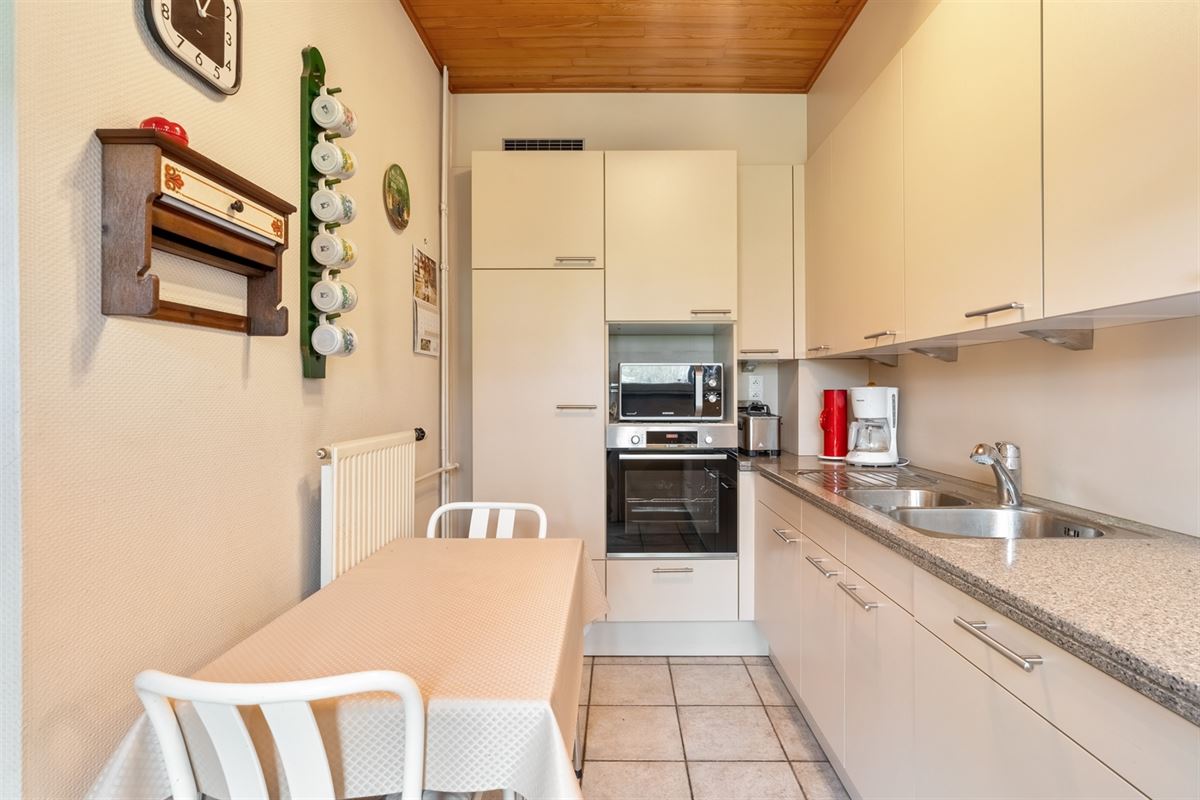 Huis halfopen bebouwing met tuin en garage