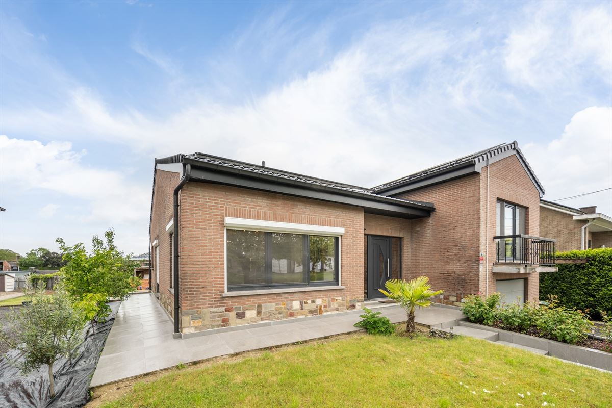 Rustig gelegen gerenoveerde woning volledig onderkelderd met ruime tuin