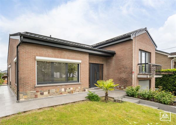 Rustig gelegen gerenoveerde woning volledig onderkelderd met ruime tuin