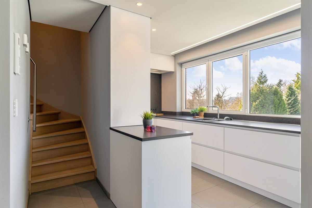 Luxeappartement met zicht op park met tennisveld