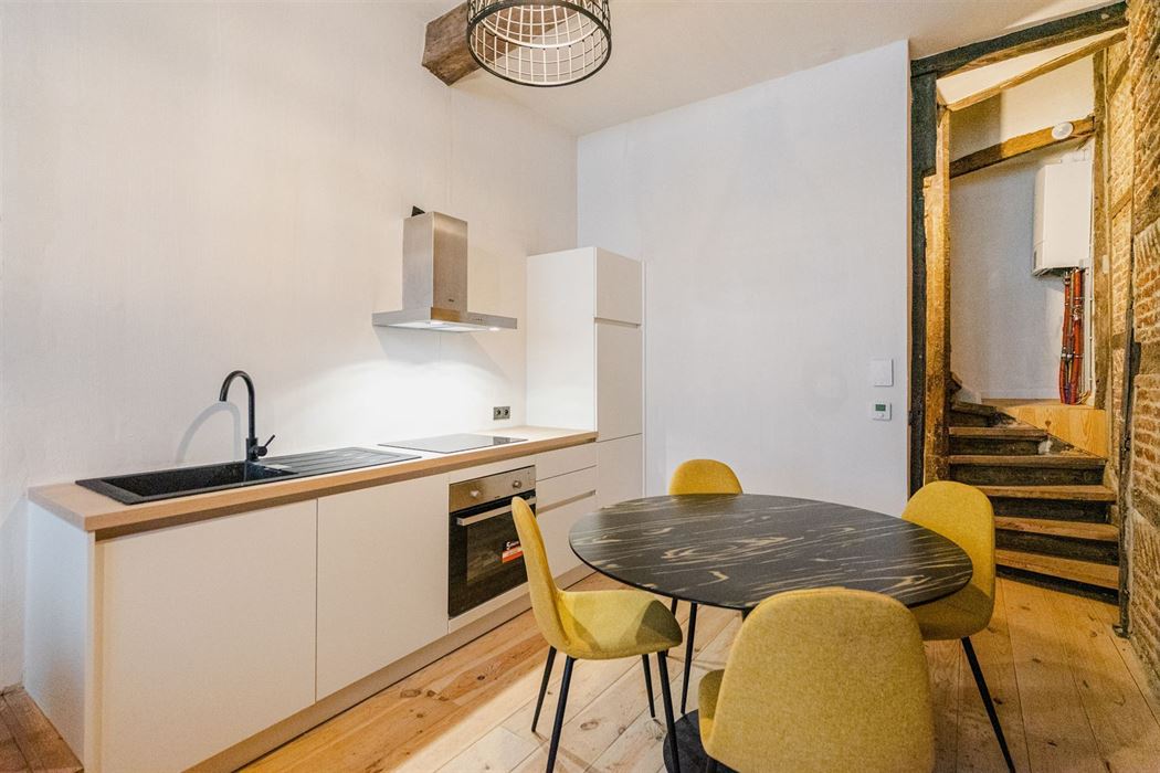 Immeuble mixte habitat./rez commercial
