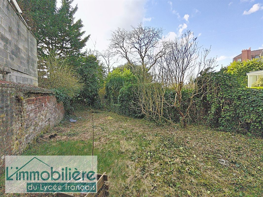 Maison avec garage et jardin à rénover, fort potentiel