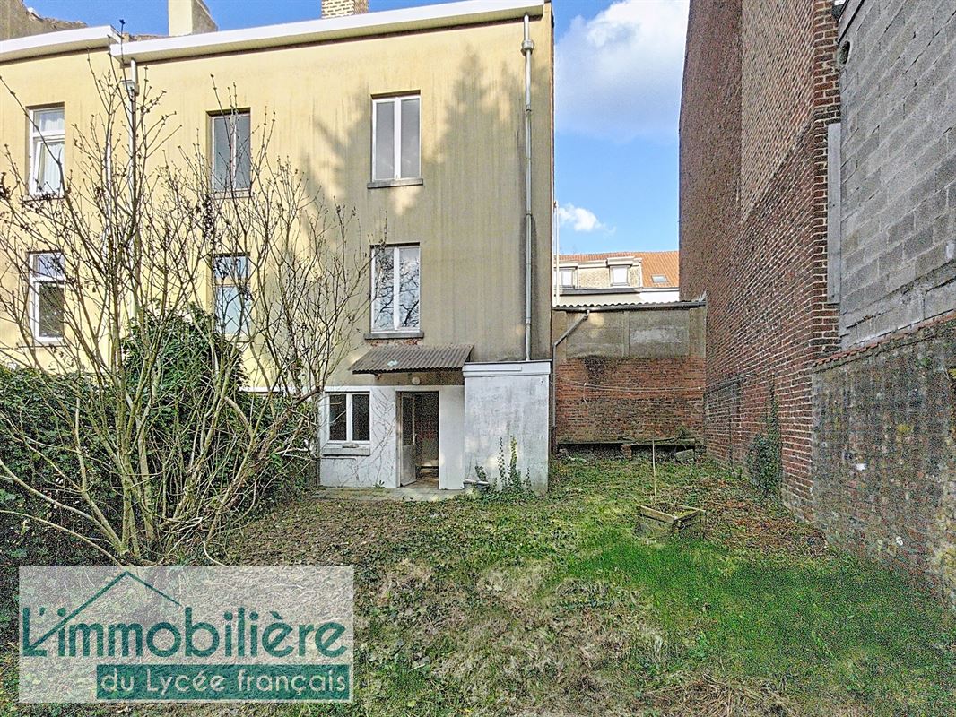 Maison avec garage et jardin à rénover, fort potentiel