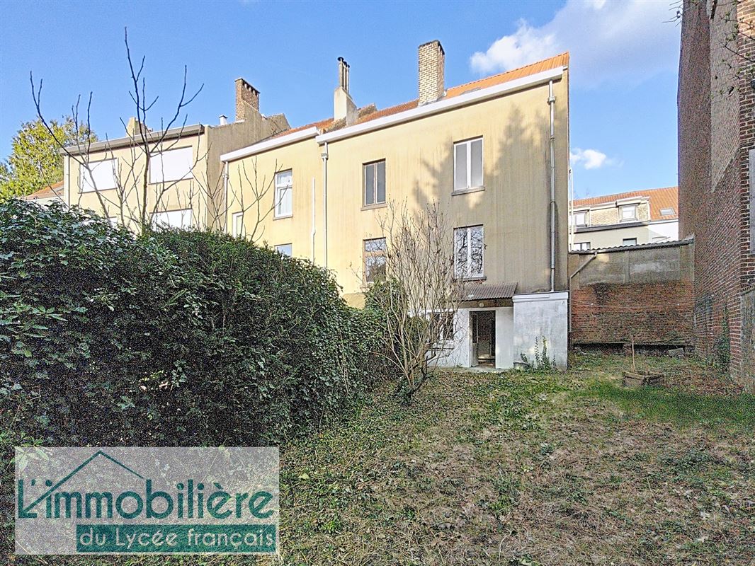 Maison avec garage et jardin à rénover, fort potentiel