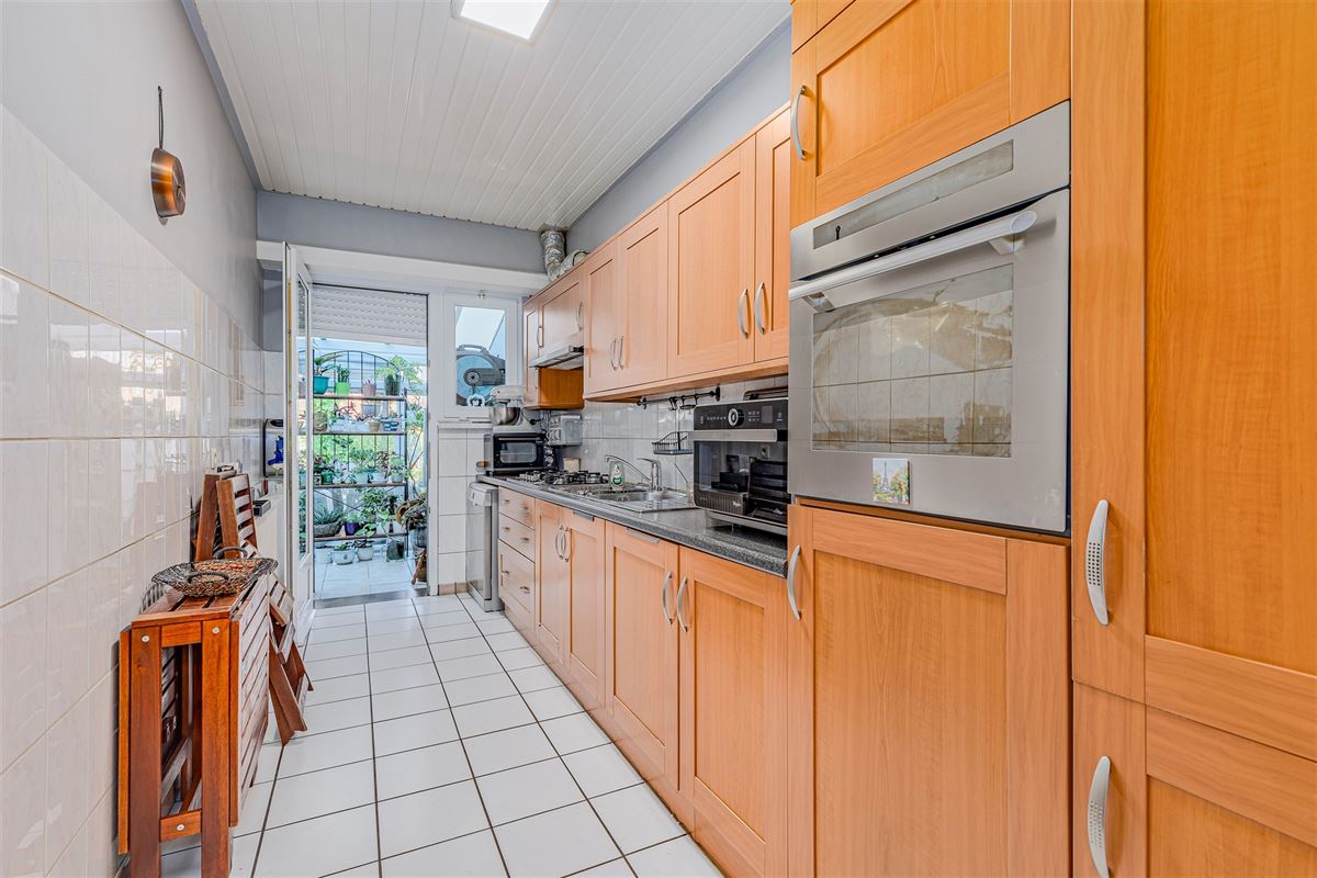 Mooi ingerichte woning met 4 slk, 2 badk en ruime stadstuin in Merksem