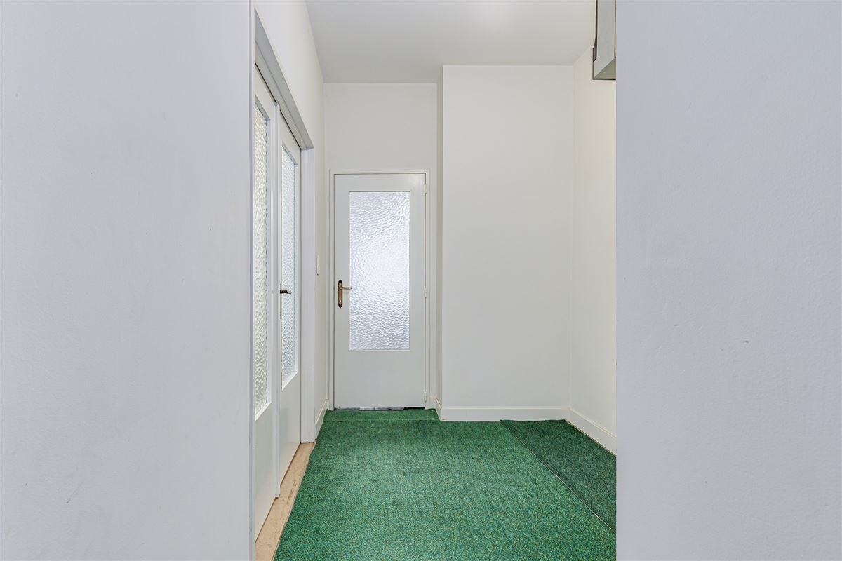 Vergund appartementsgebouw met 3 appt, handelsglvl en tuin in Merksem!