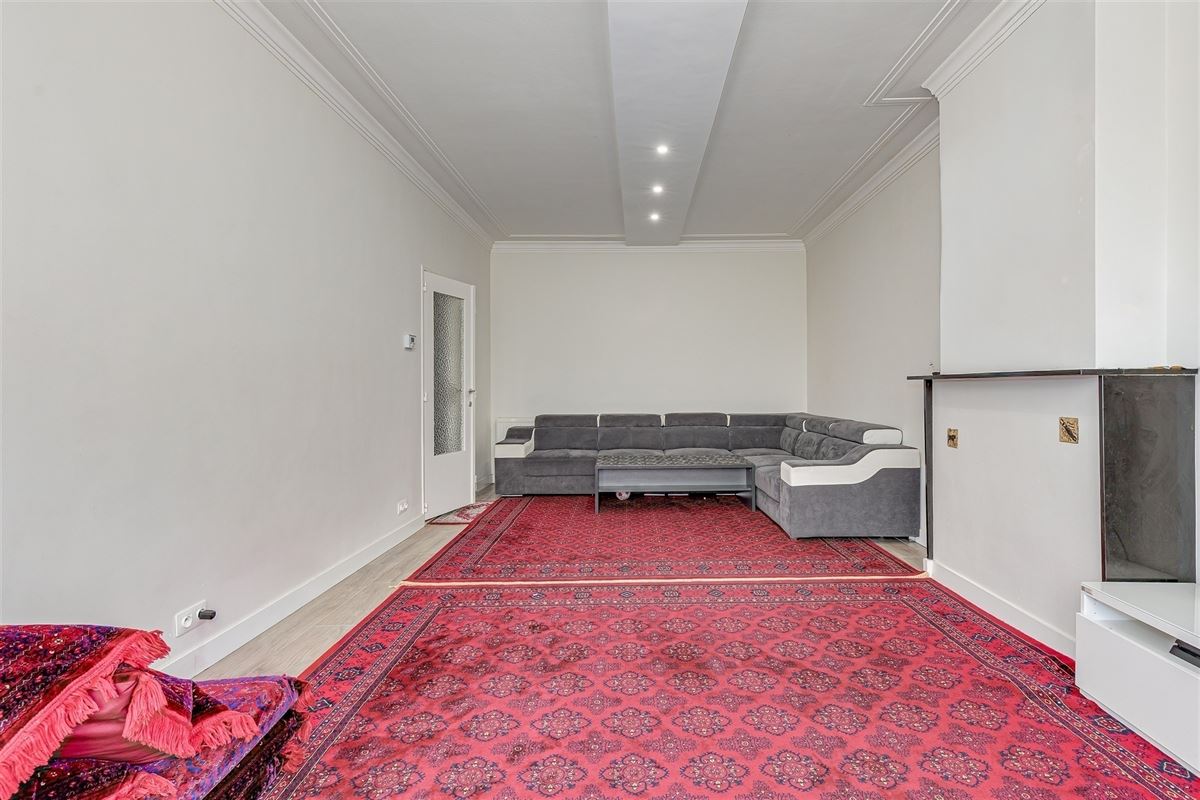 Vergund appartementsgebouw met 3 appt, handelsglvl en tuin in Merksem!