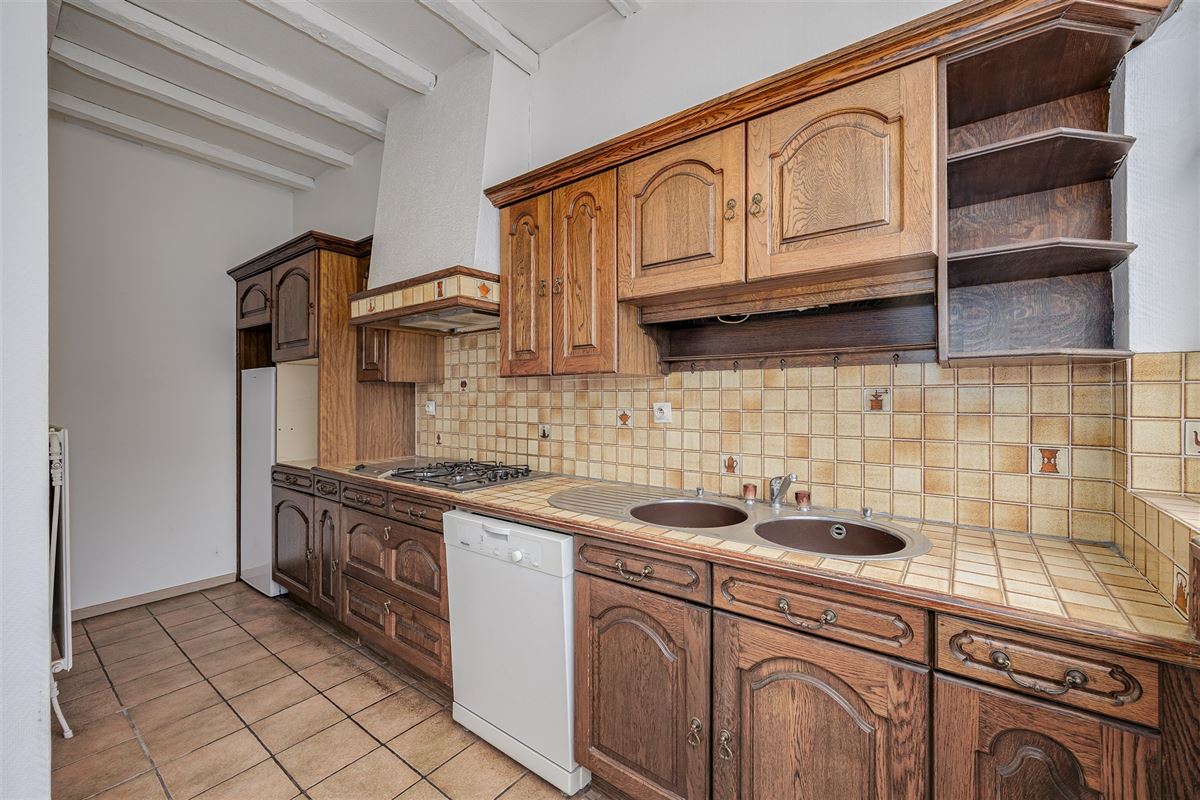 Uniek hoekperceel met handelshuis + garage + appt