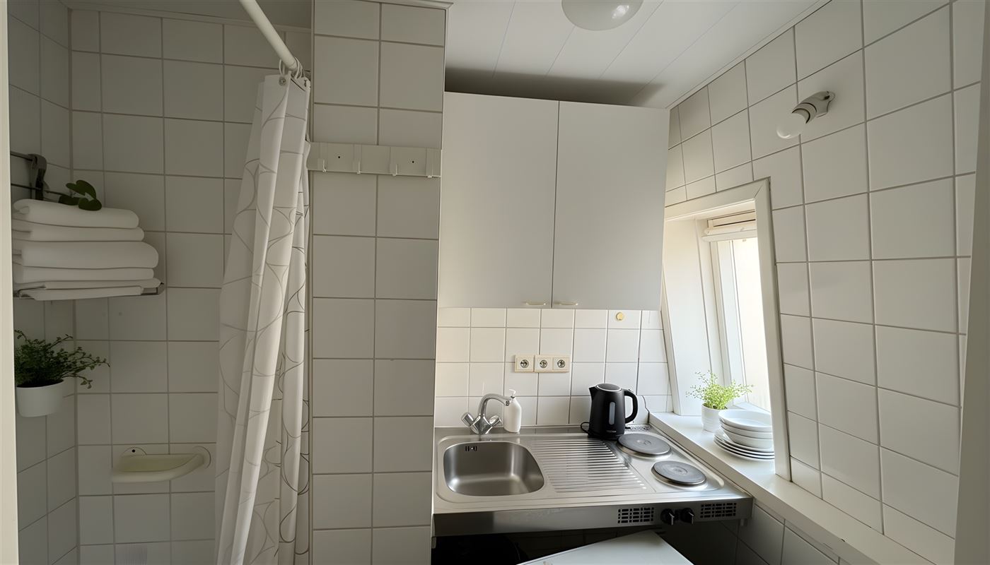 Kamerwoning met 6 kamers en handelsgelijkvloers.