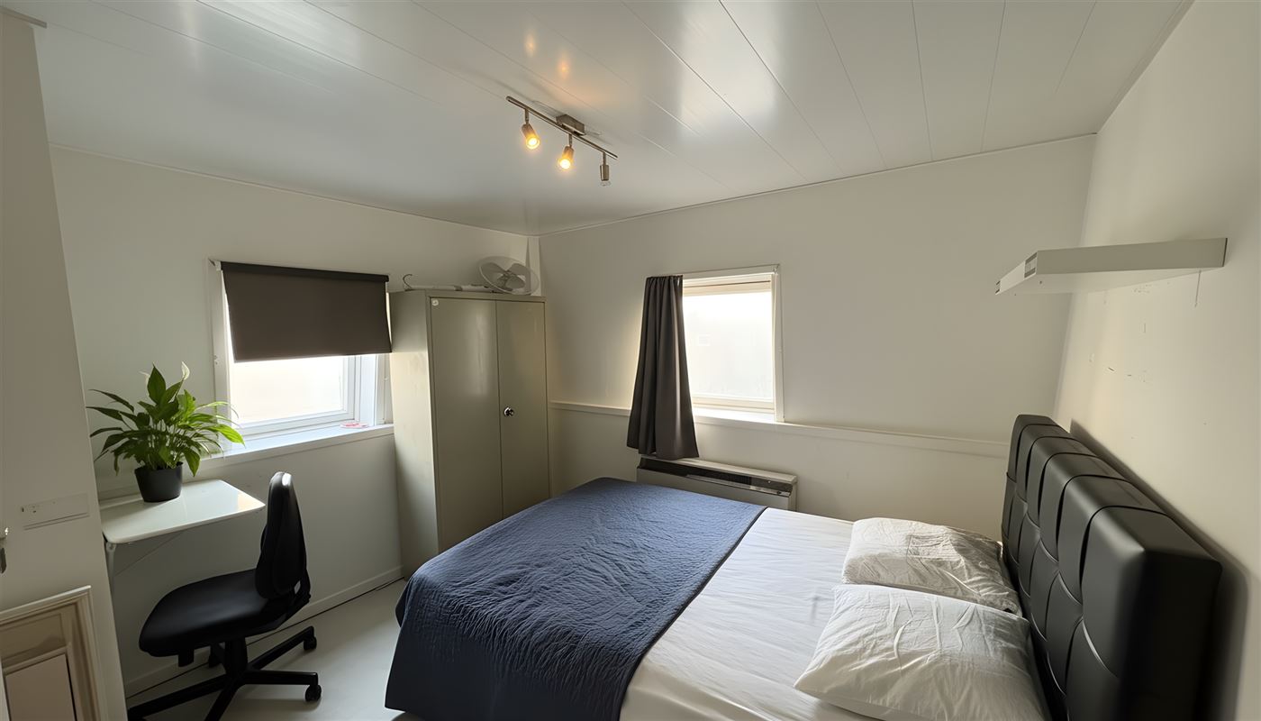 Kamerwoning met 6 kamers en handelsgelijkvloers.