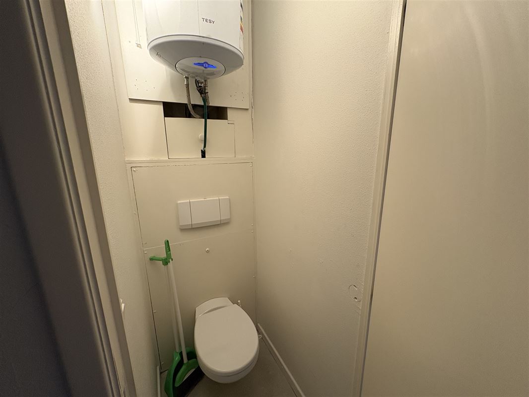Kamerwoning met 6 kamers en handelsgelijkvloers.
