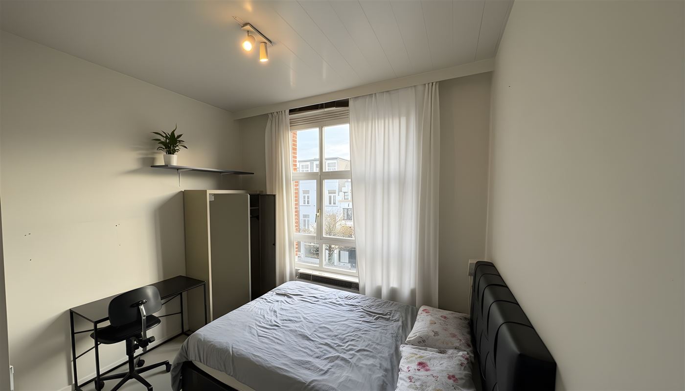 Kamerwoning met 6 kamers en handelsgelijkvloers.