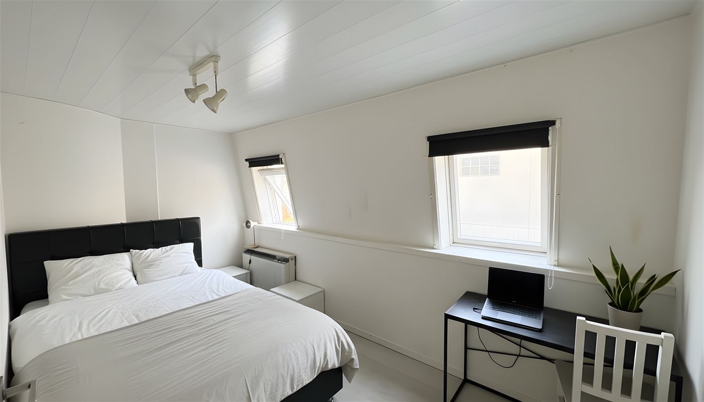 Kamerwoning met 6 kamers en handelsgelijkvloers.