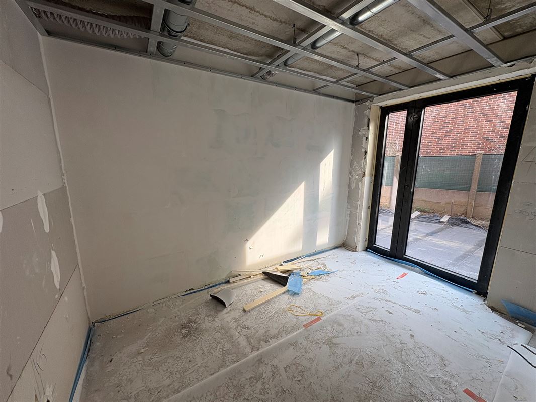 Gelijkvloersappartement met 3 slaapkamers en tuin.