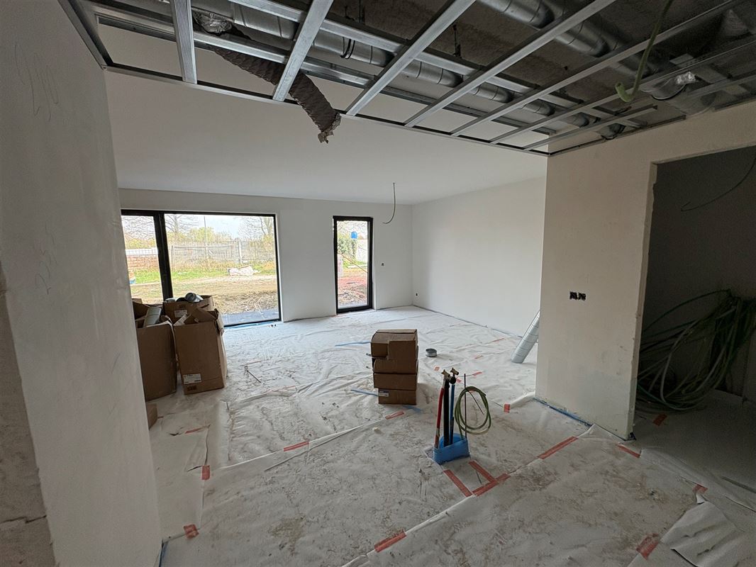 Gelijkvloersappartement met 2 slaapkamers en tuin.