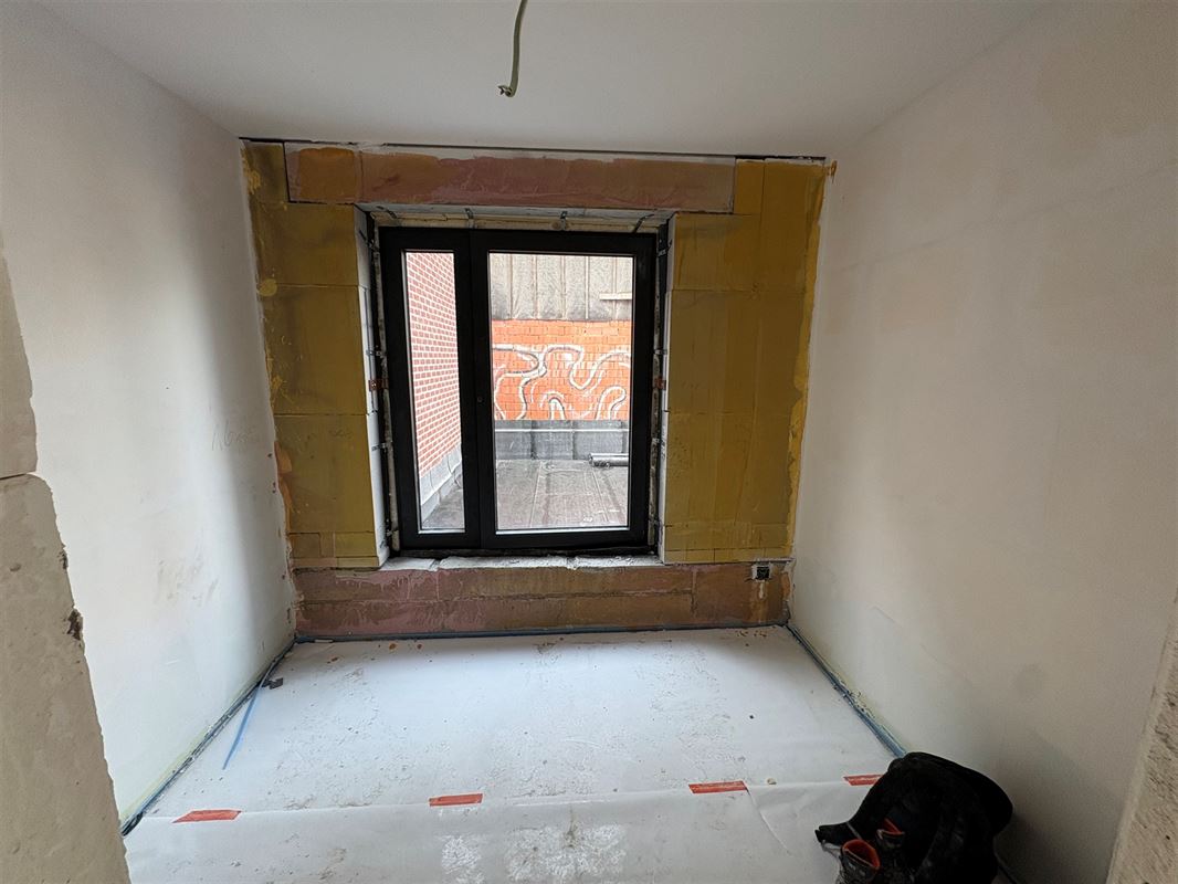 Gelijkvloersappartement met 2 slaapkamers en tuin.