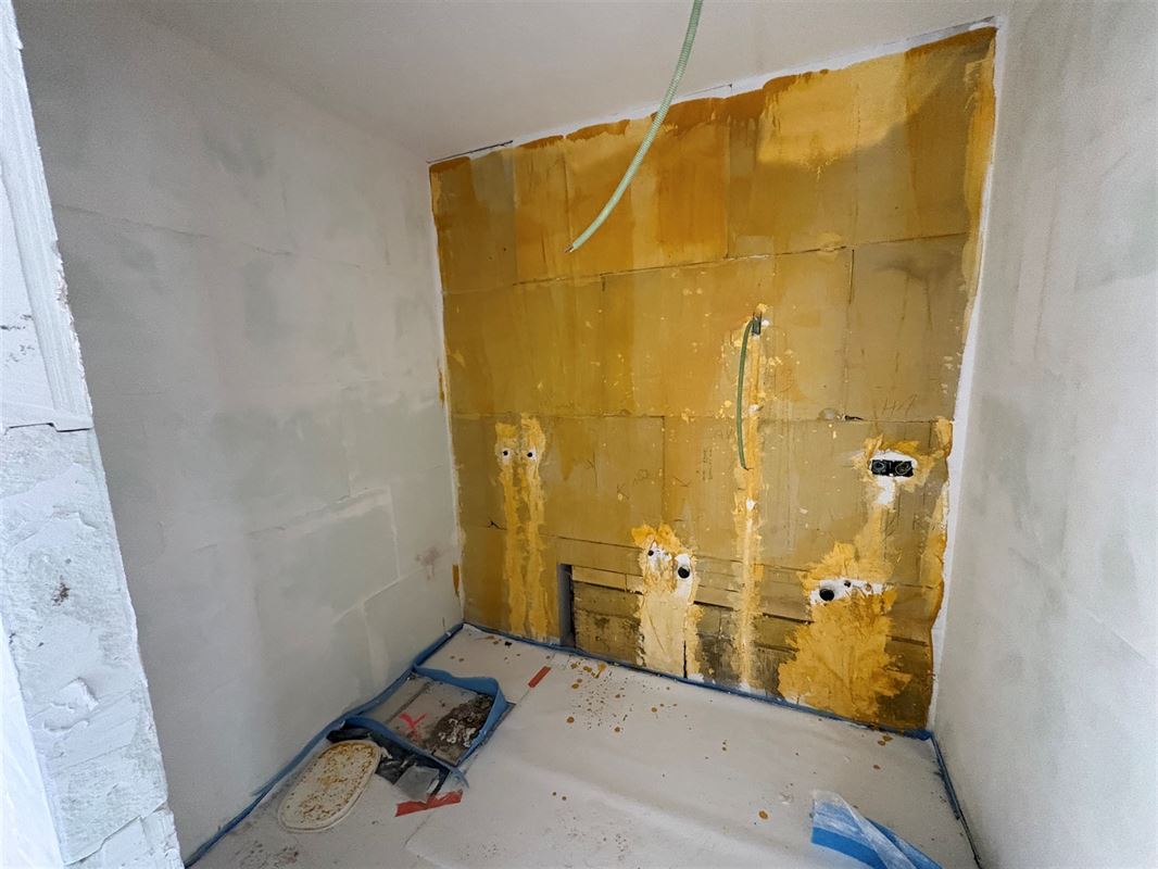 Gelijkvloersappartement met 2 slaapkamers en tuin.