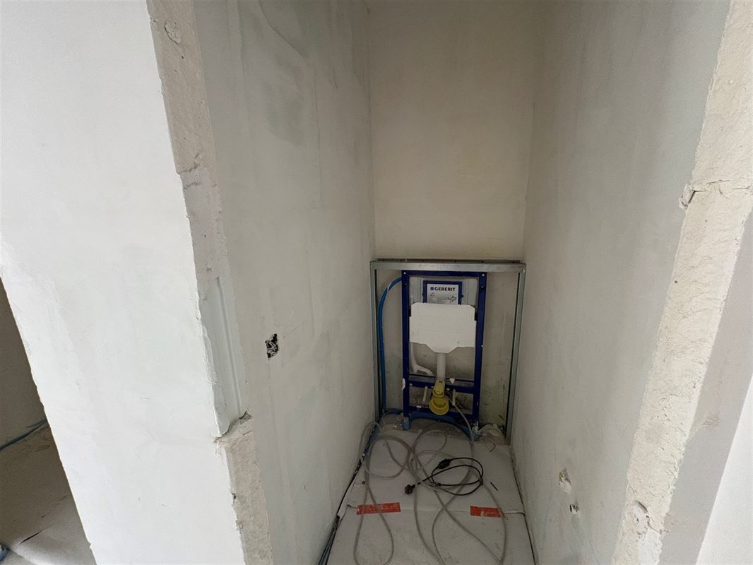 Gelijkvloersappartement met 2 slaapkamers en tuin.