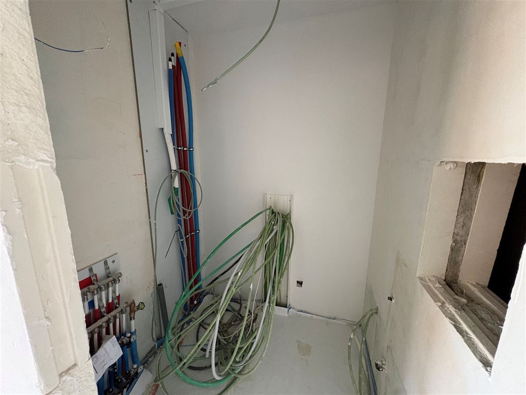 Gelijkvloersappartement met 2 slaapkamers en tuin.